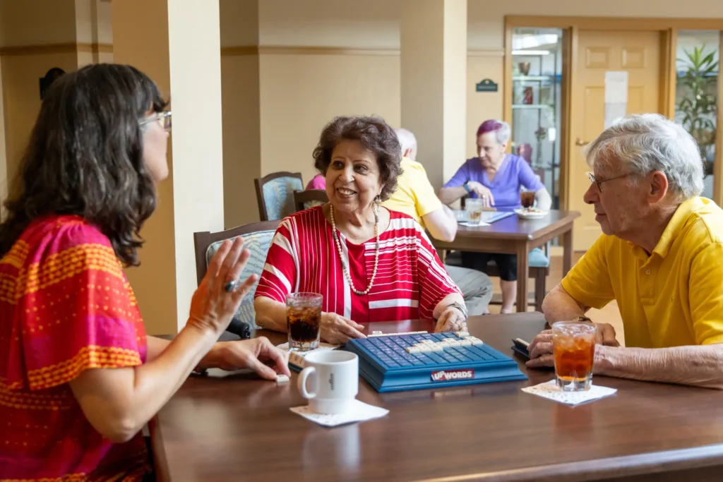 Residents enjoying safe indoor activities together during winter at Canterbury Woods