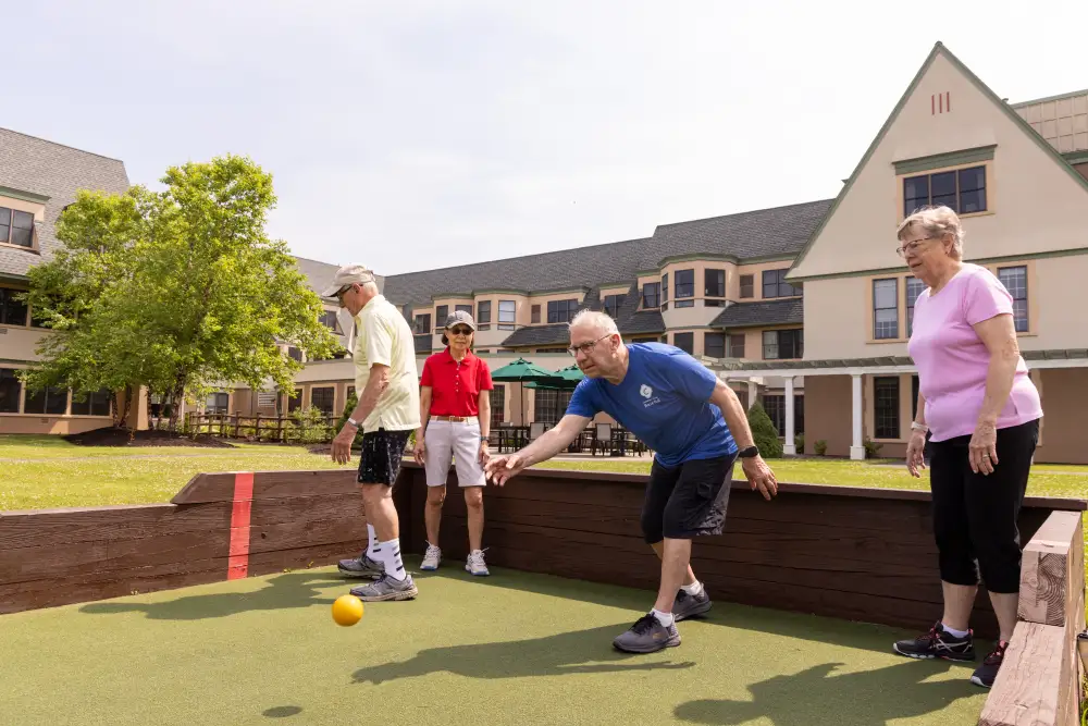 a group of Canterbury Woods Williamsville residents playing bocce ball