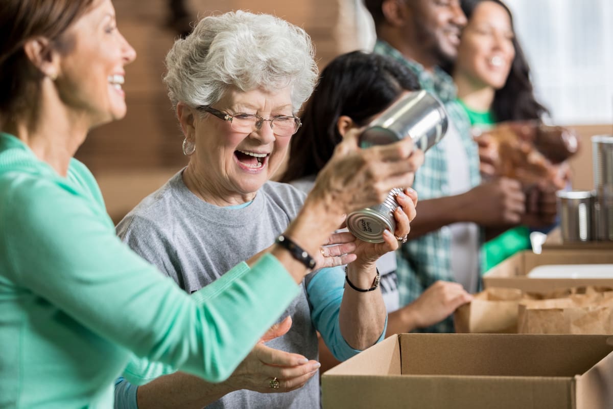 women working at a canned food drive