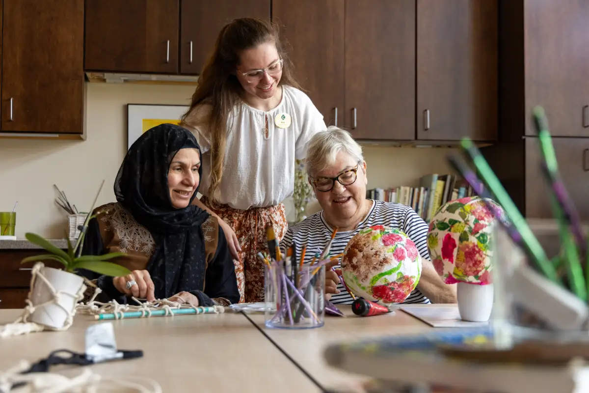 senior women painting in an art class at Canterbury Woods